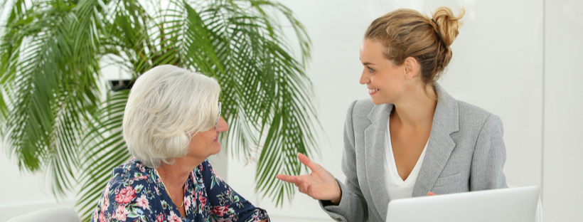 Senior woman talking to a financial advisor