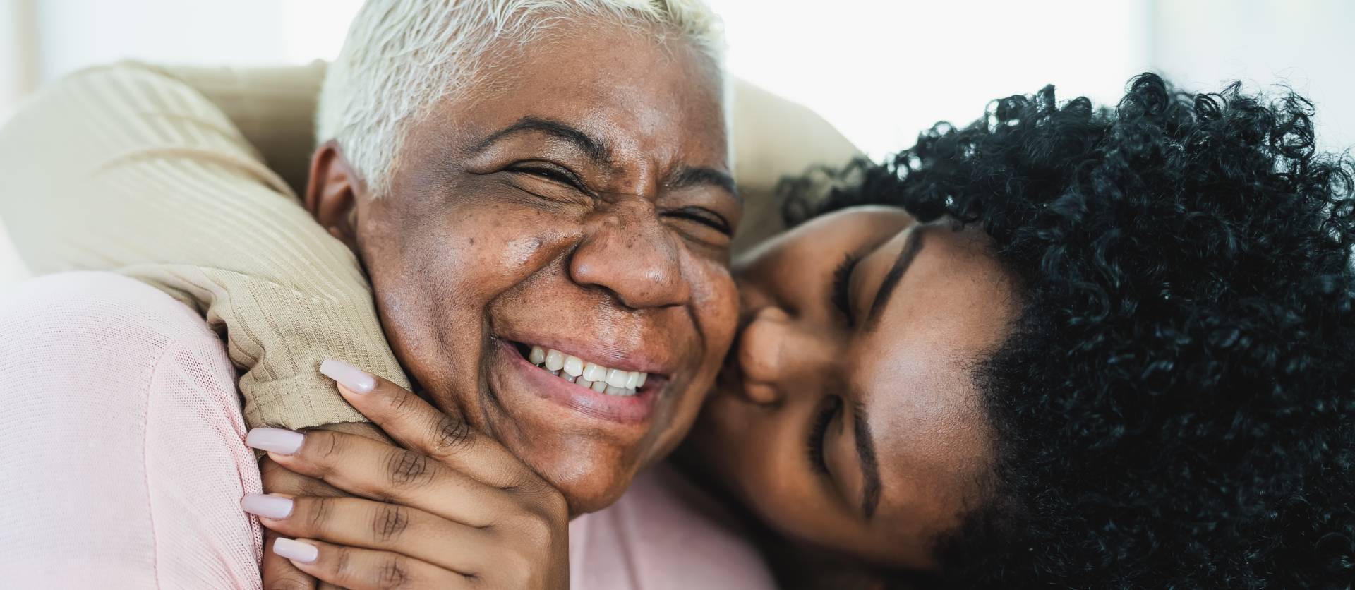 senior lady hugging a loved one