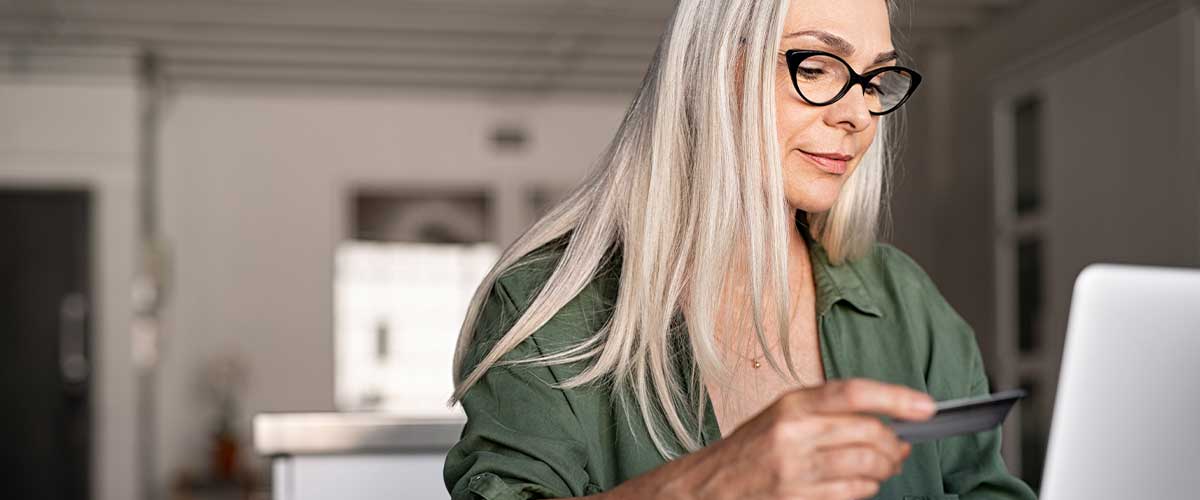 Senior woman making online purchase