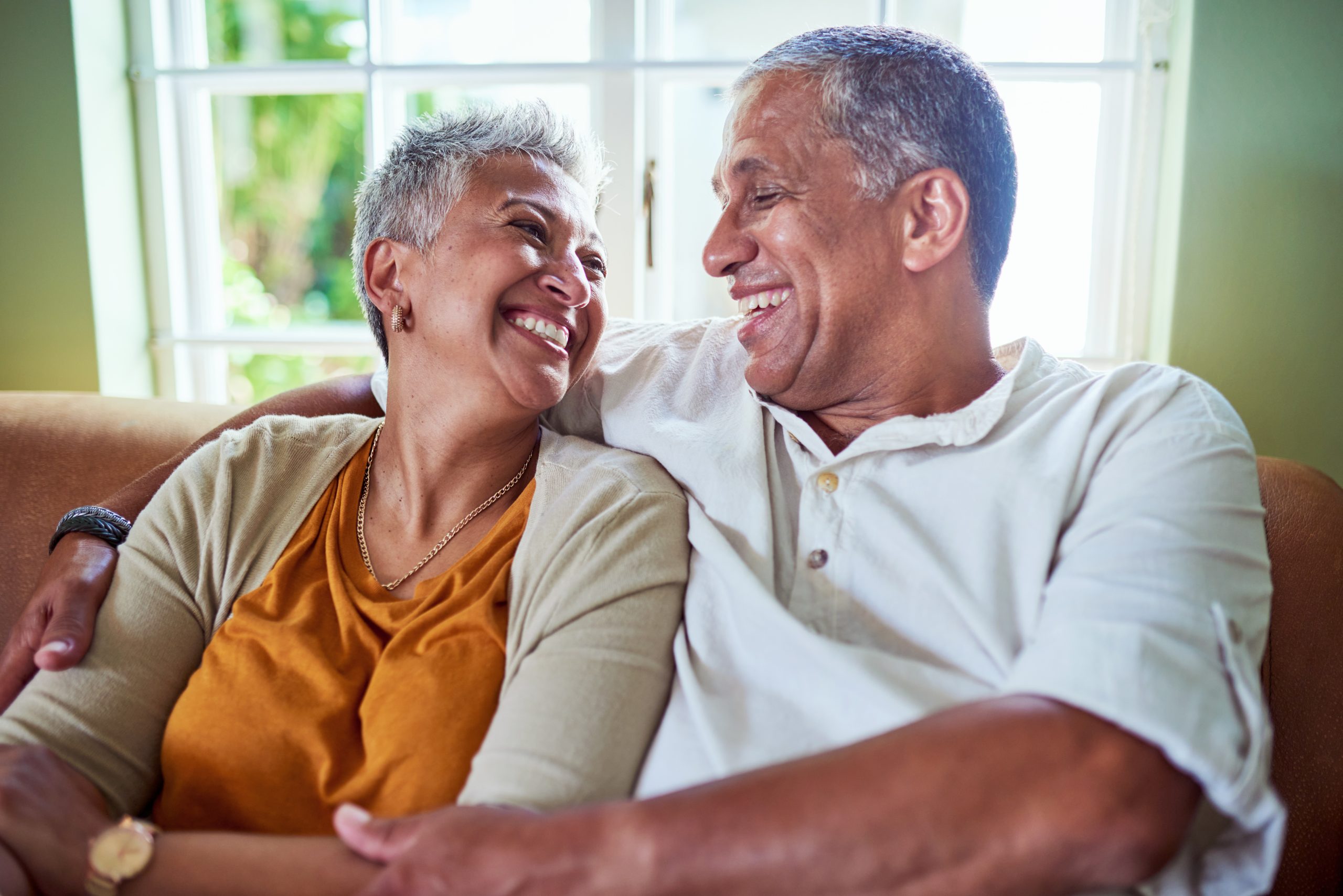 Senior couple smiling at each other